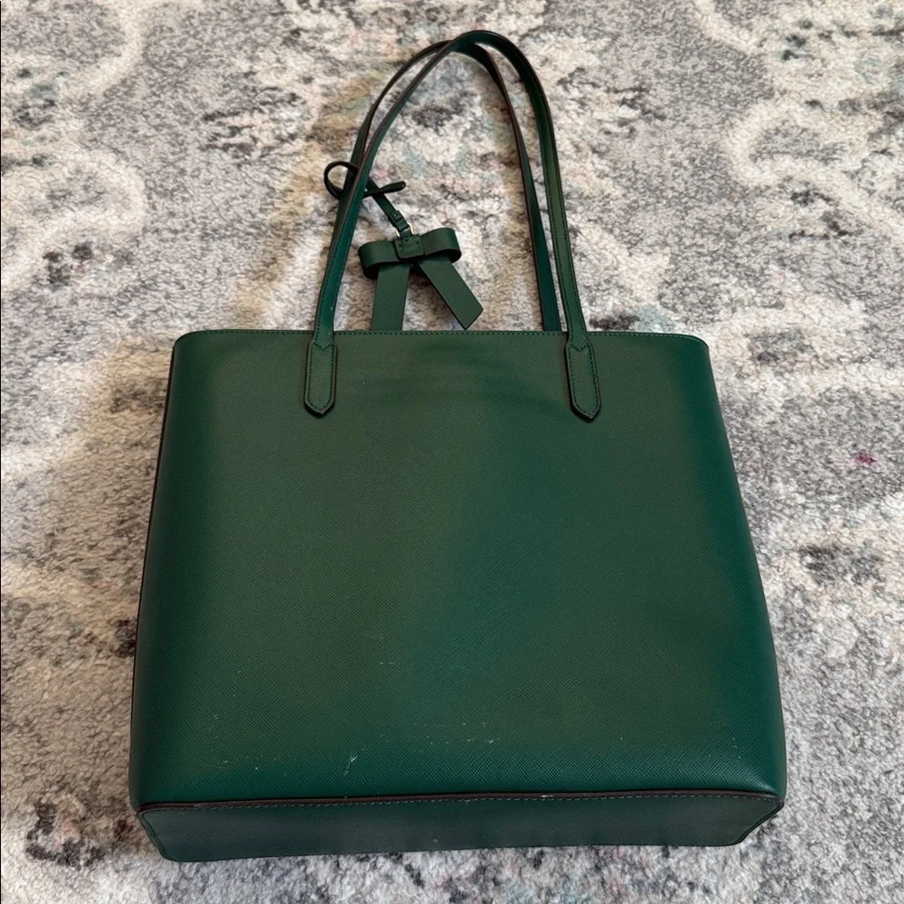 Kate Spade Brynn leather tote bag in the deep jade color with bow charm